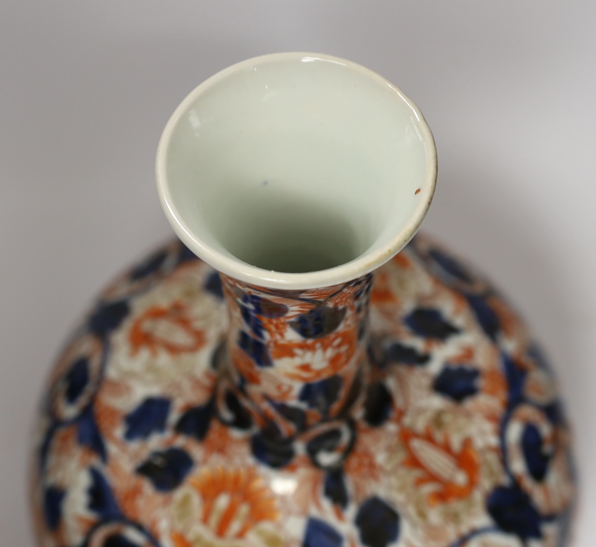 A pair of Chinese blue and white crackleware vases and covers and an Imari vase and cover, largest 31cm high